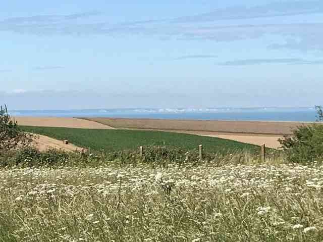 A clear view of The White Cliffs of Dover, seen from the opposite cliffs in France.